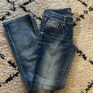 Ariya, boot cut, size 7/8, med-light wash, very light distress, low-rise